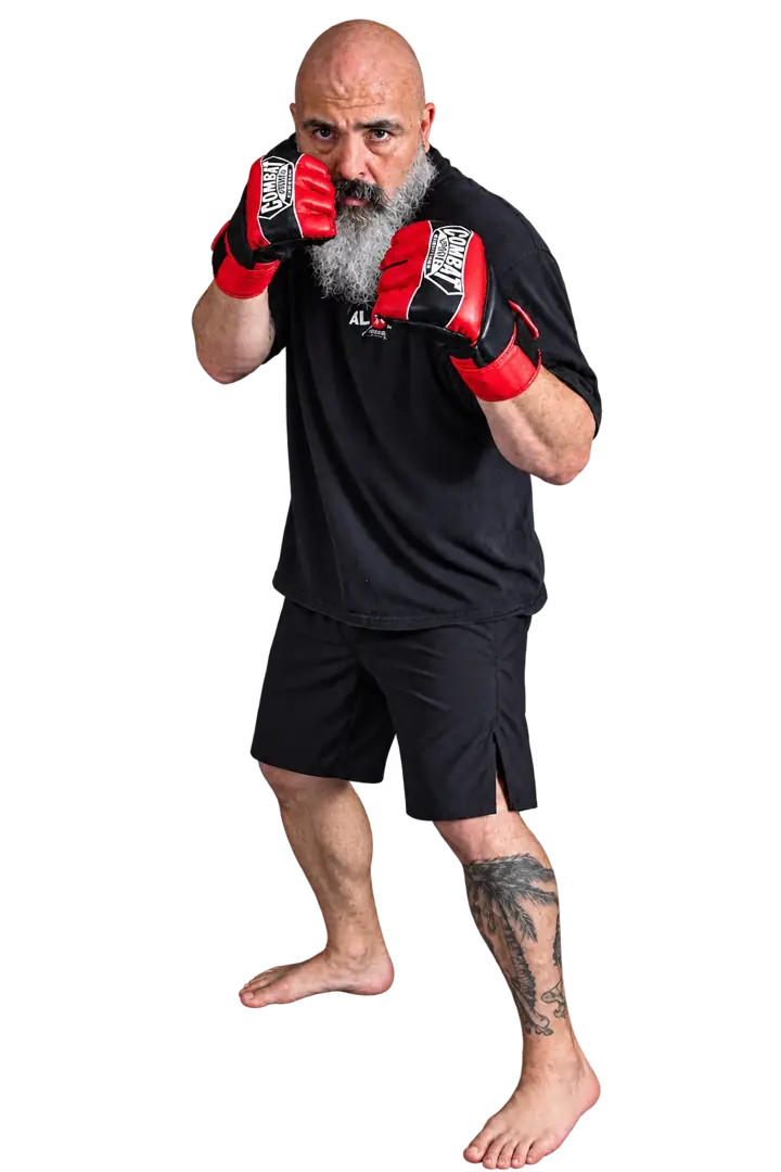 Coach Jeff in a guard stance wearing red boxing gloves