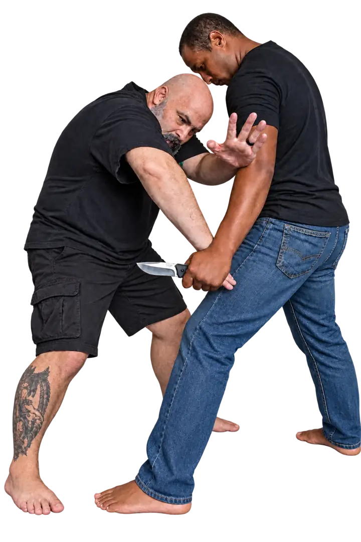 Coach Jeff and a training partner practicing Defensive Tactics with a blade