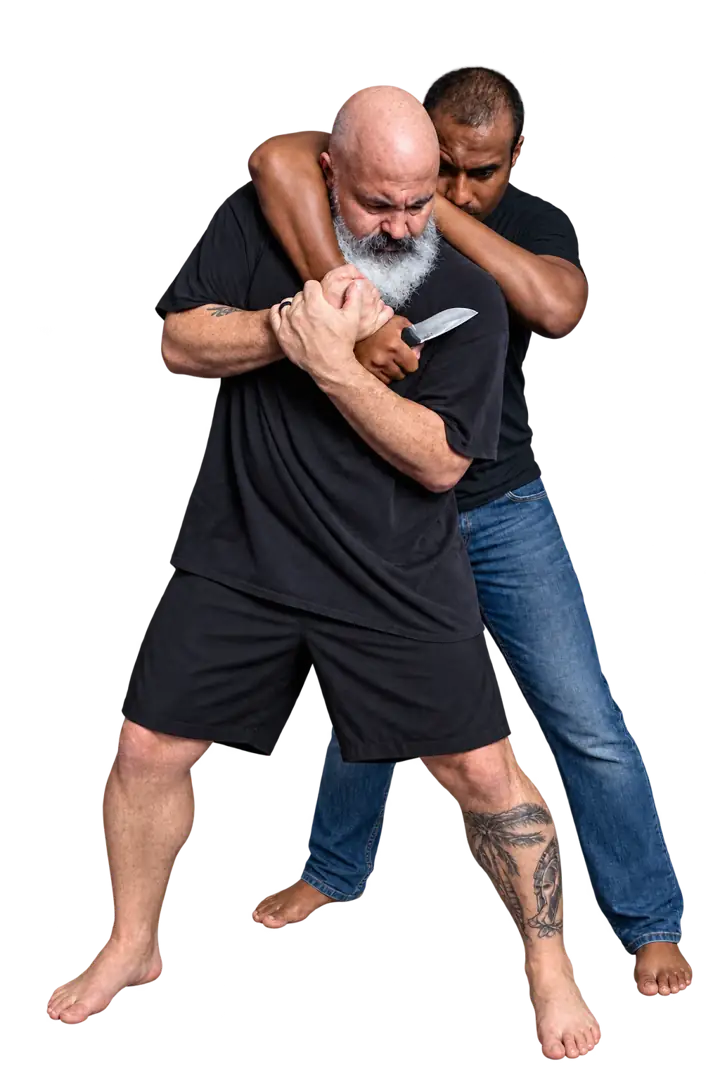 Coach Jeff and a training partner demonstrating a close-range grab and blade scenario